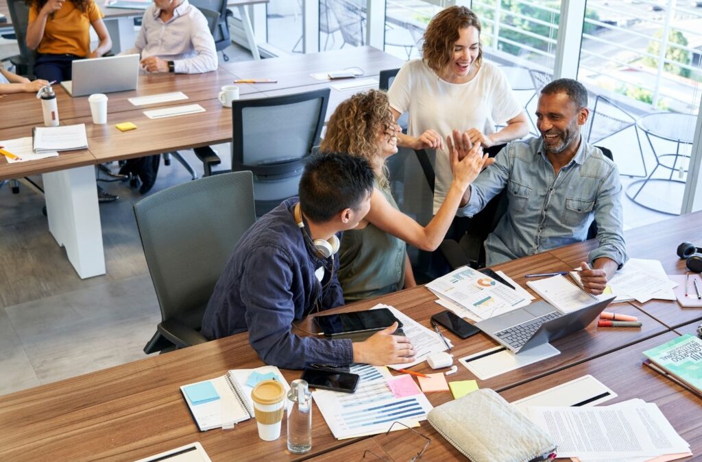 Group of people working in an office. Unlocking Success: The Power of Empathy in Organizations