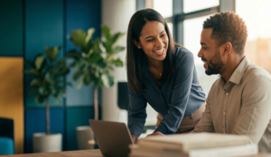 Two people at work discussing how to practice empathy in the workplace