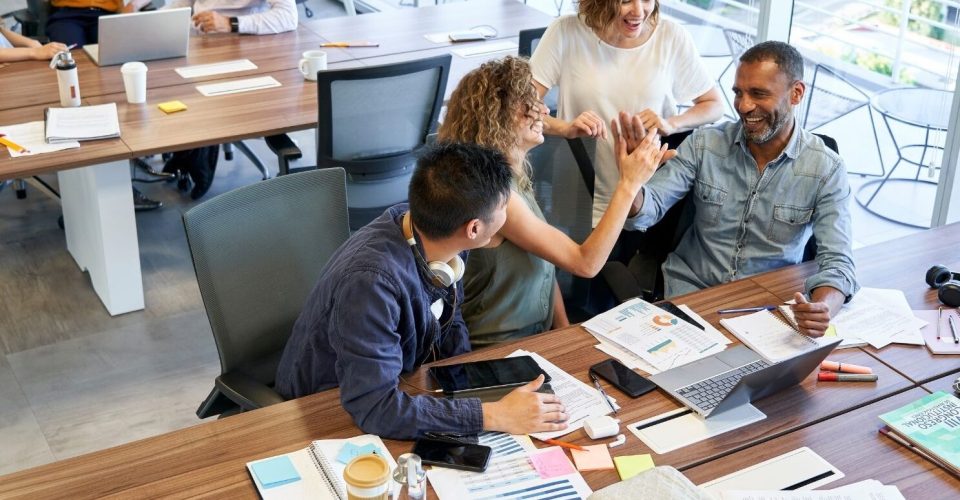 Group of people working in an office. Unlocking Success: The Power of Empathy in Organizations