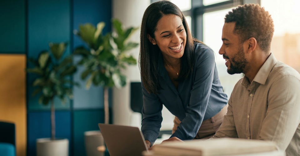 Two people at work discussing how to practice empathy in the workplace